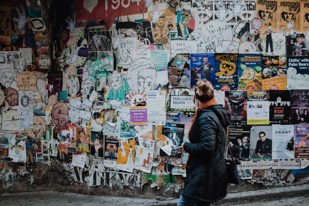 person-standing-beside-wall-during-daytime-zo-txe8tinw